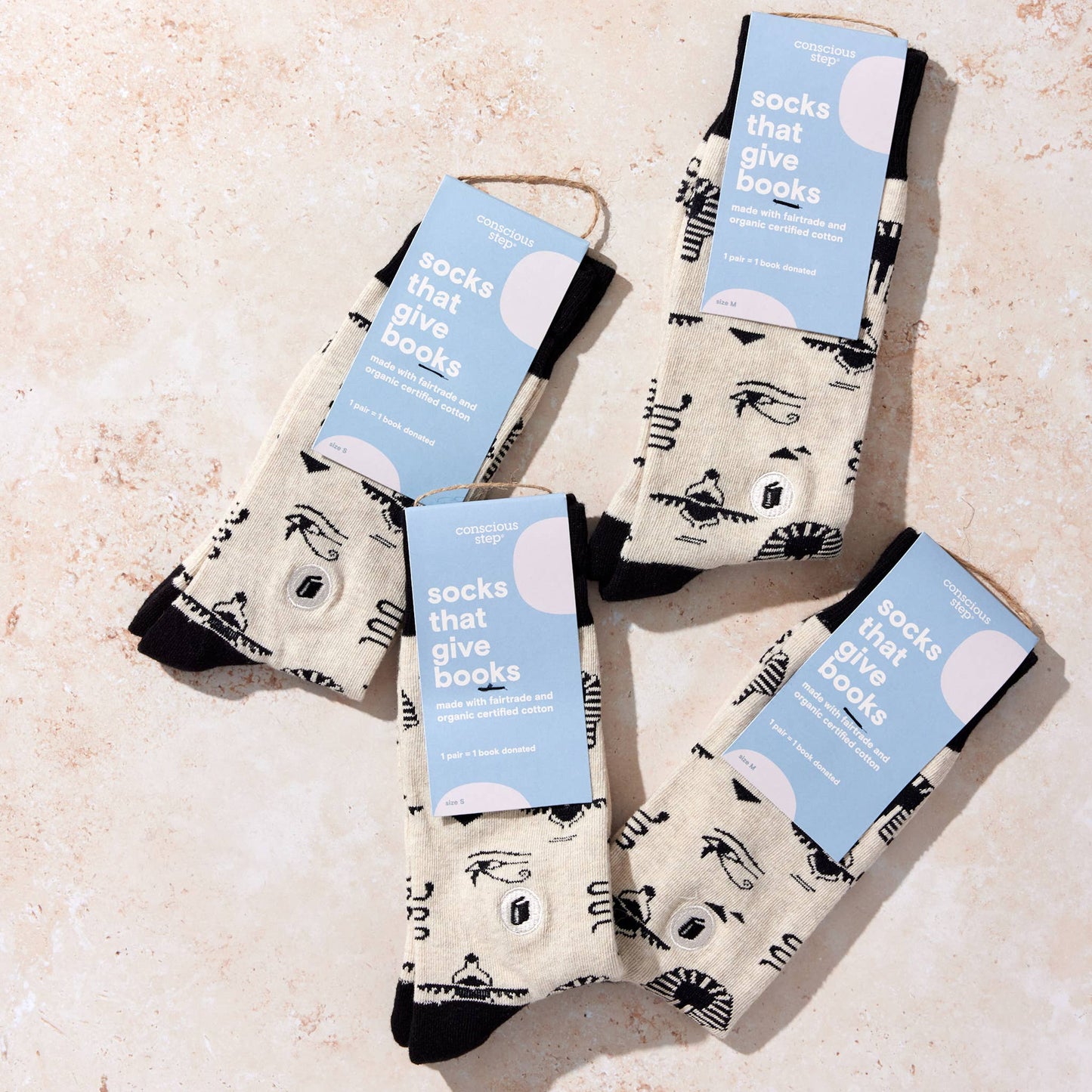 Conscious Step - Socks that Give Books  (Ivory Hieroglyphics): Medium